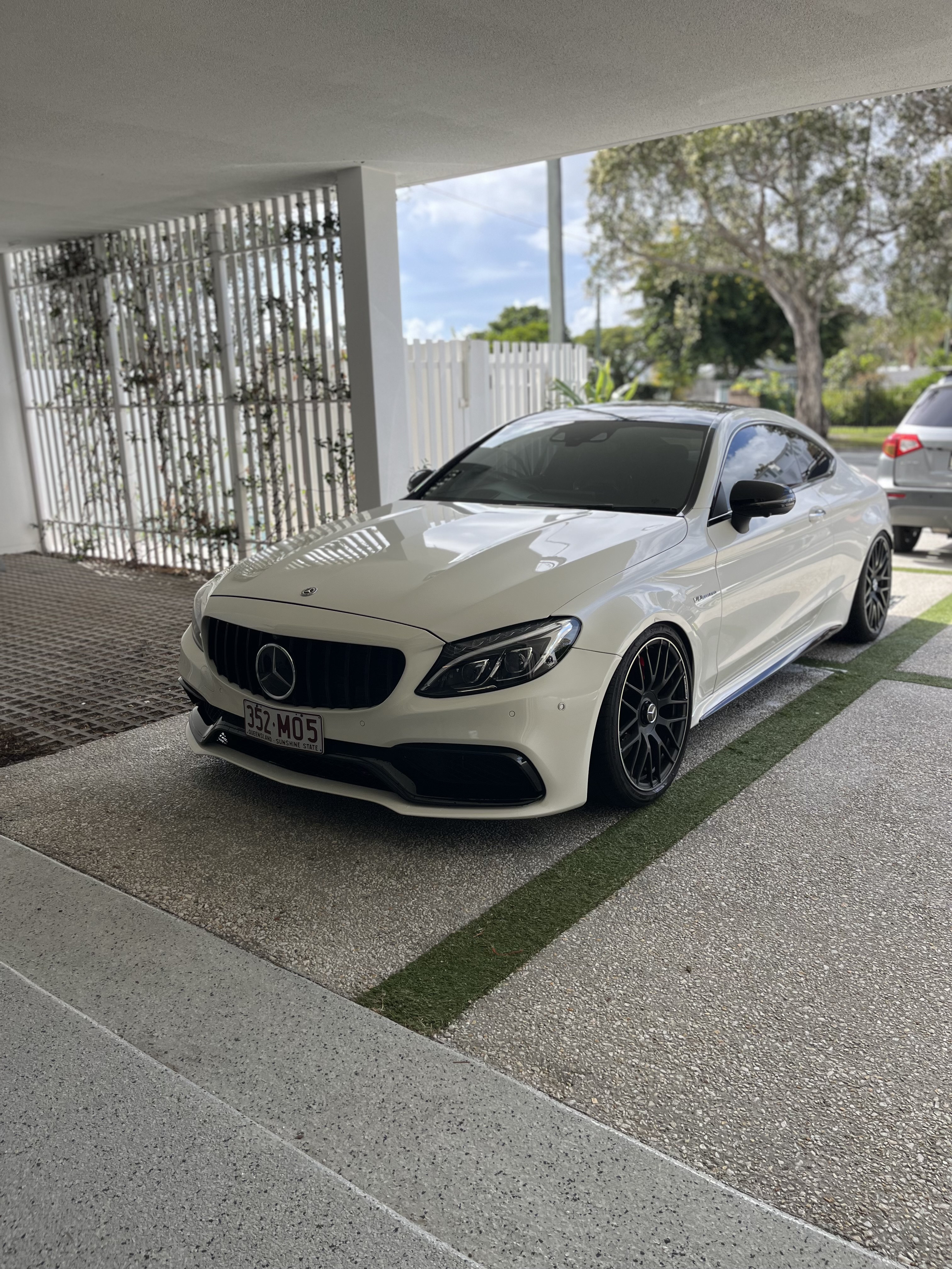 White Mercedes coupe front exterior after detailing