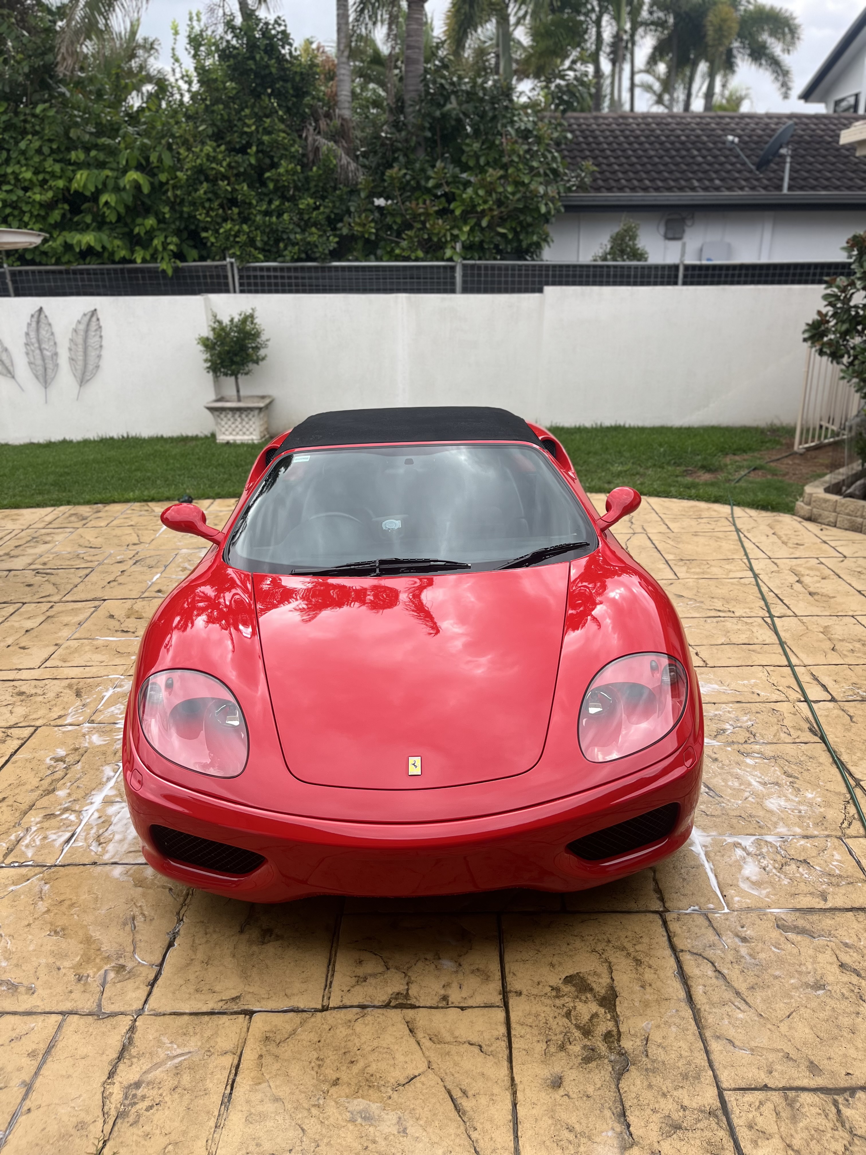Red Ferrari after exterior detailing